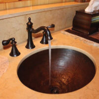Copper sink and faucet available at Wallace Lumber Company